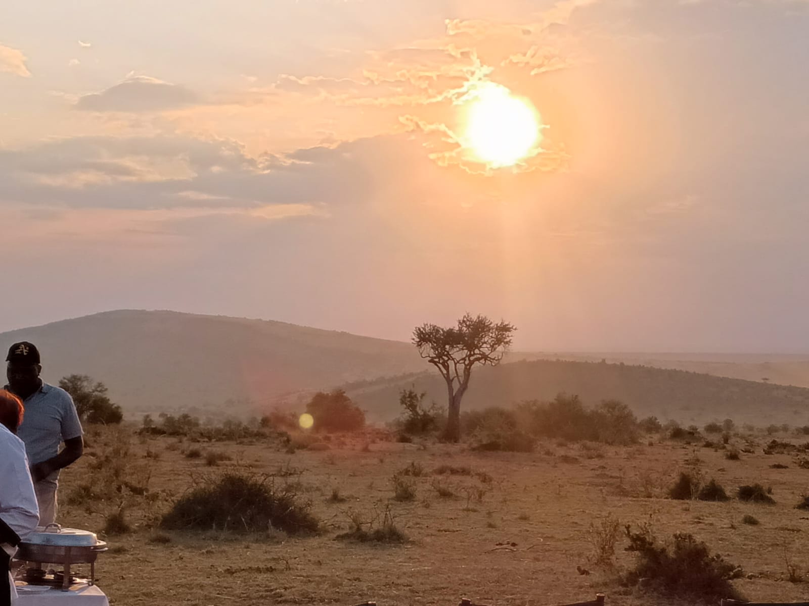Sunset bush service table overlooking the Maasai Mara hills