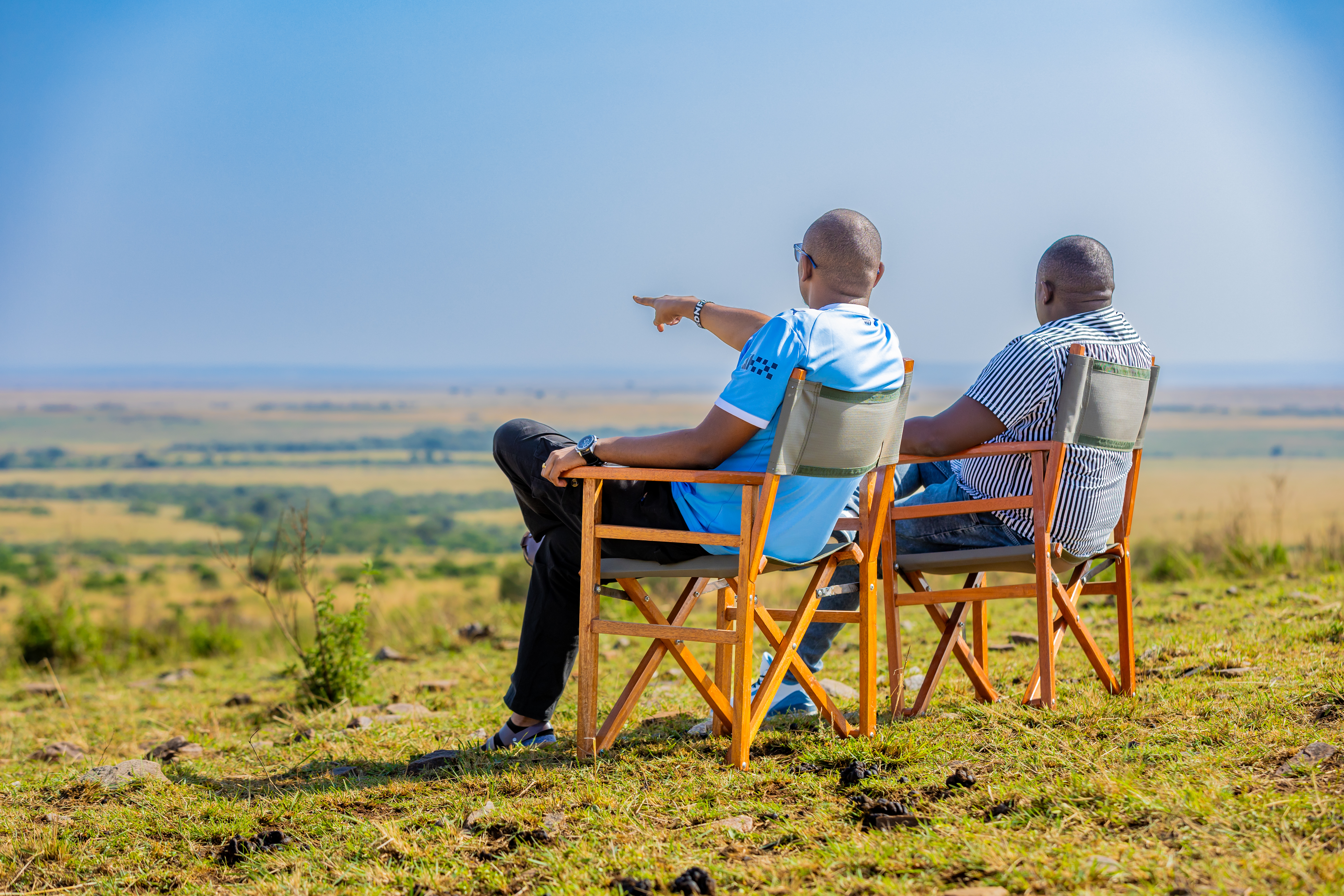 Wide Maasai Mara grasslands stretching to the horizon